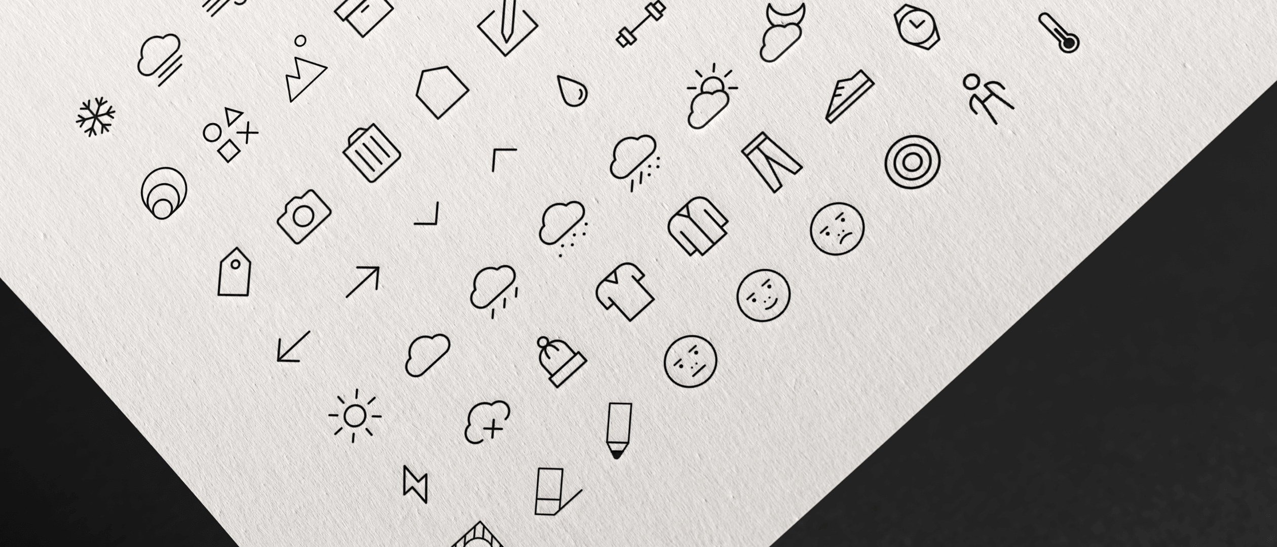 Lookscope icon system printed on paper — weather, garments, expressions
